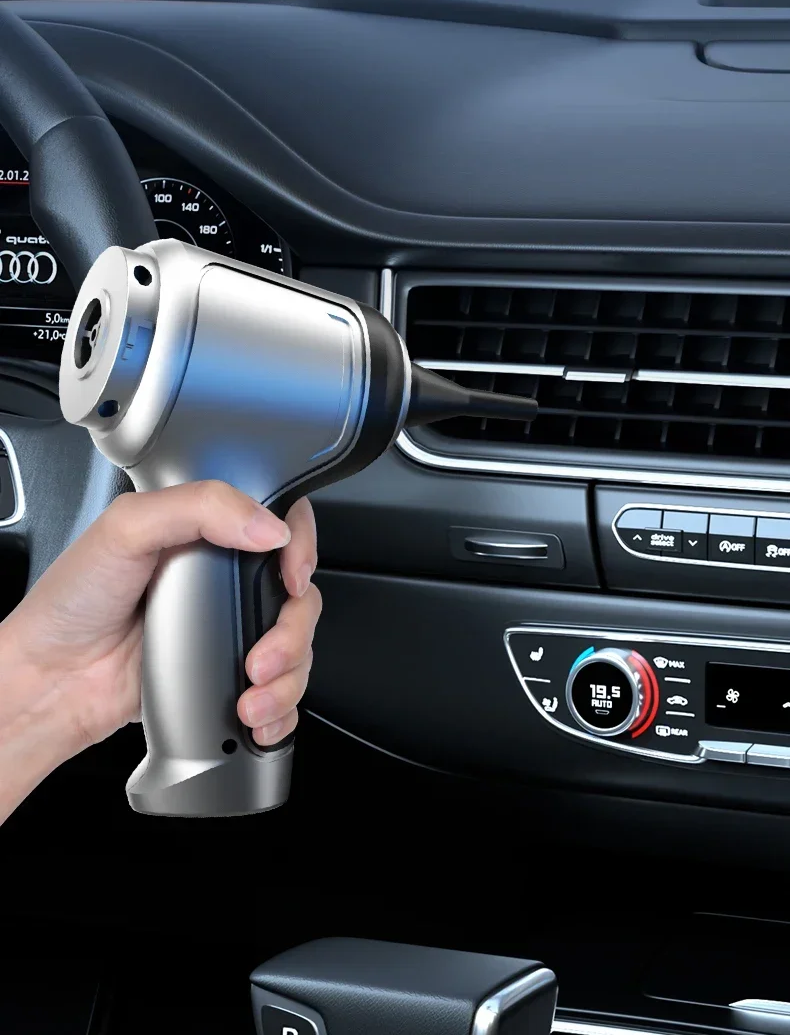 Cordless car vacuum cleaning crumbs from a car seat. Portable handheld design for quick vehicle interior detailing.