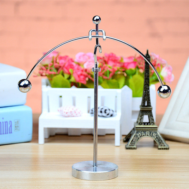 Captivating stainless steel kinetic art pendulum, a stylish balance desk toy for stress relief.