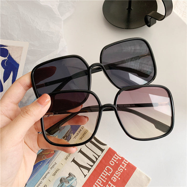 Sleek unisex square sunglasses providing trendy UV protection for versatile everyday outdoor style.