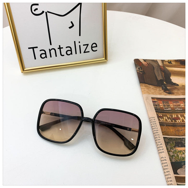 Trendy unisex square sunglasses, a classic fashion accessory for sleek summer beachwear and eye protection.
