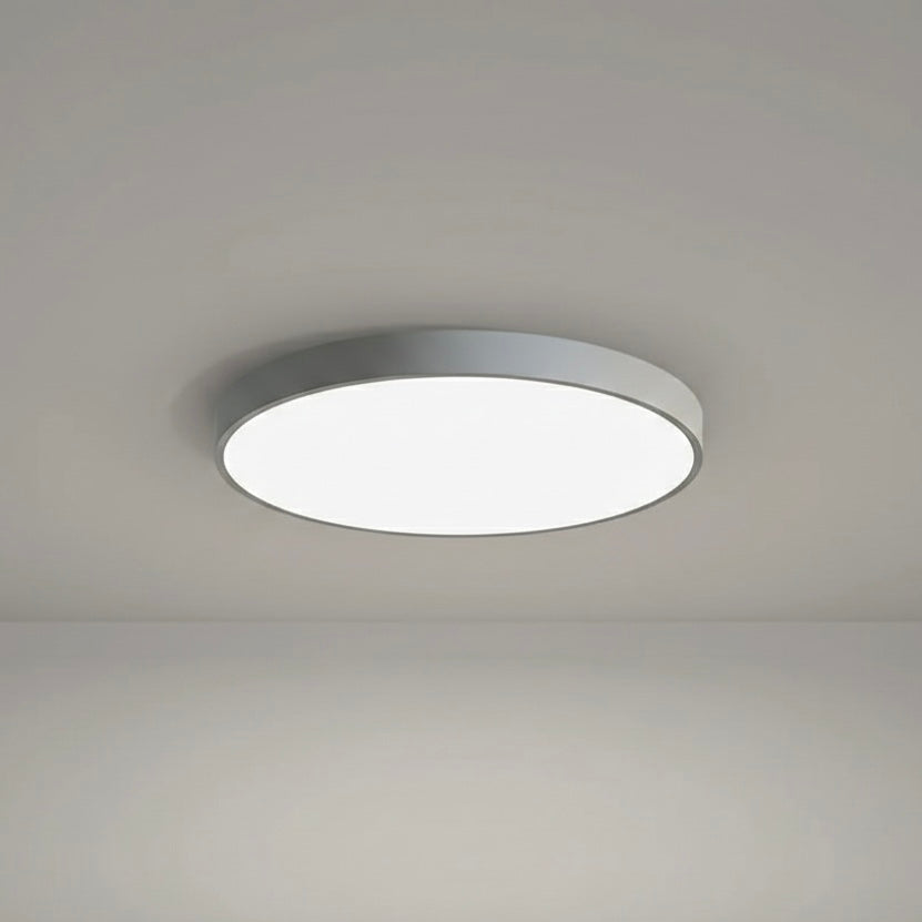 Slim profile LED flush ceiling light, modern round design, dimmable for optimal ambiance.