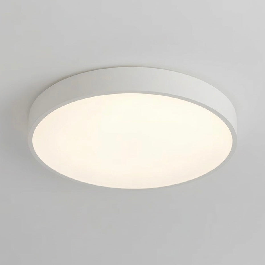 Energy-efficient LED flush ceiling light, slim design, dimmable for ambient lighting.
