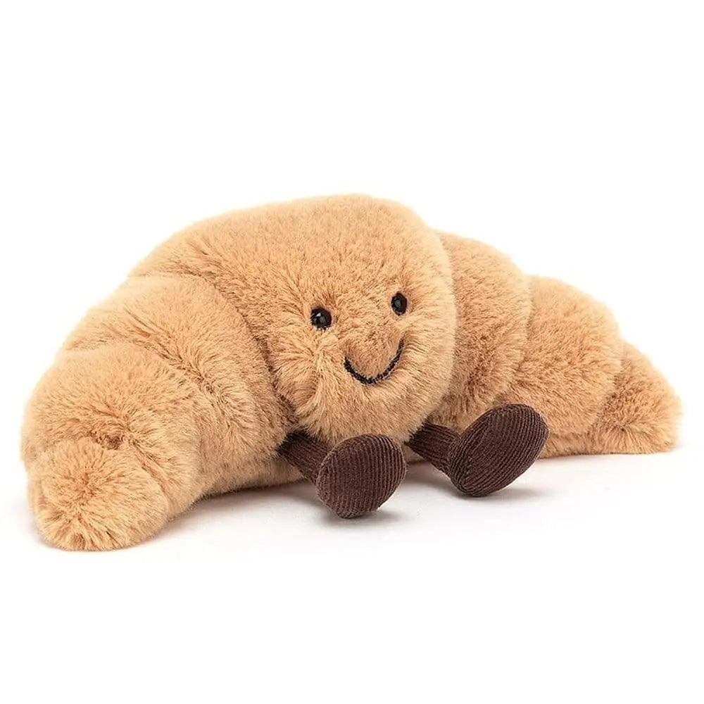 Cute beige croissant plush toy. Soft, huggable accent pillow, perfect novelty decor & comfort gift for kids.