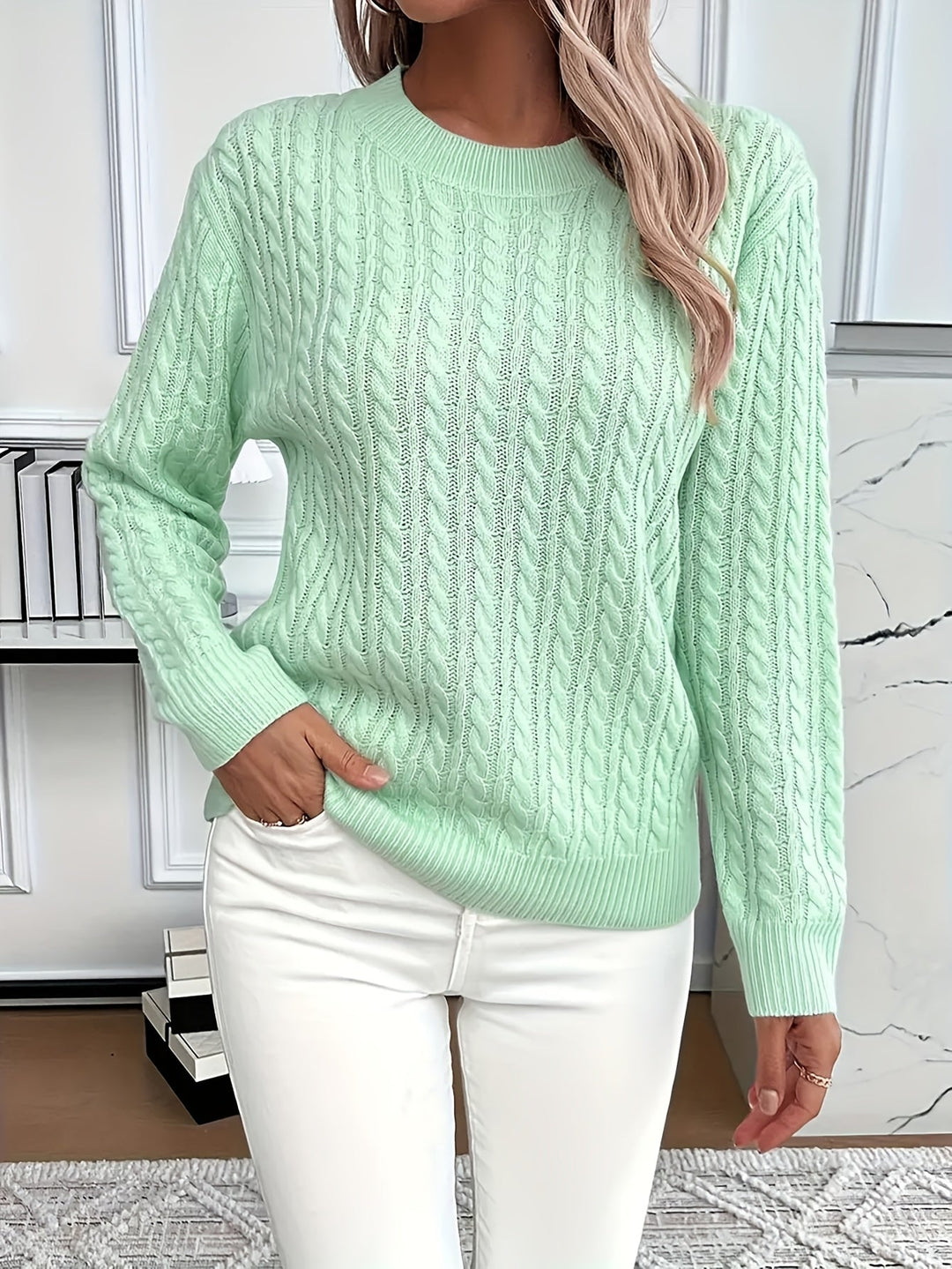 Soft cable knit women's sweater, perfect for stylish spring & autumn fashion. Cozy long sleeve round neck knitwear.