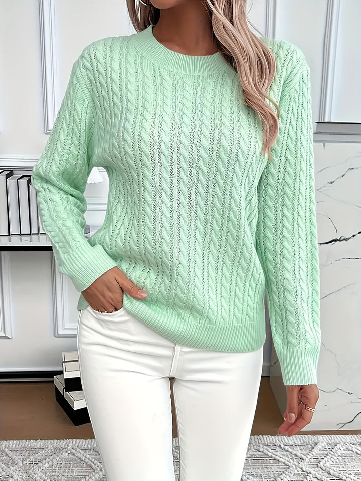 Soft cable knit women's sweater, perfect for stylish spring & autumn fashion. Cozy long sleeve round neck knitwear.