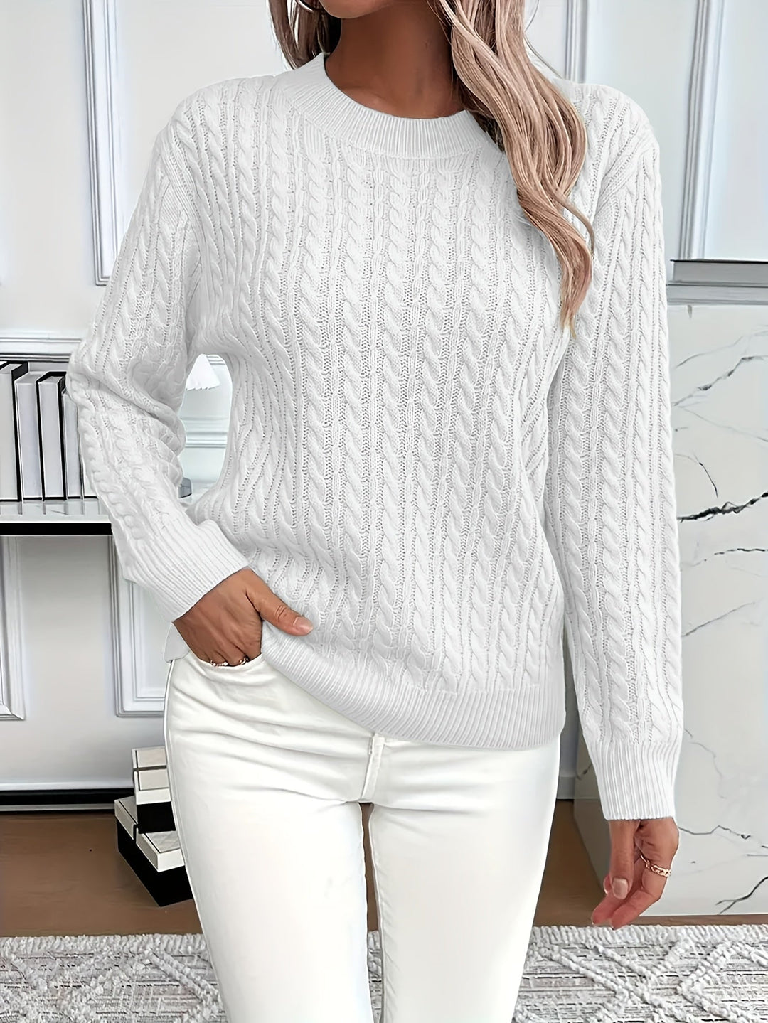 Close-up of a soft cable knit women's sweater, showcasing texture. Perfect stylish knitwear for spring & autumn.
