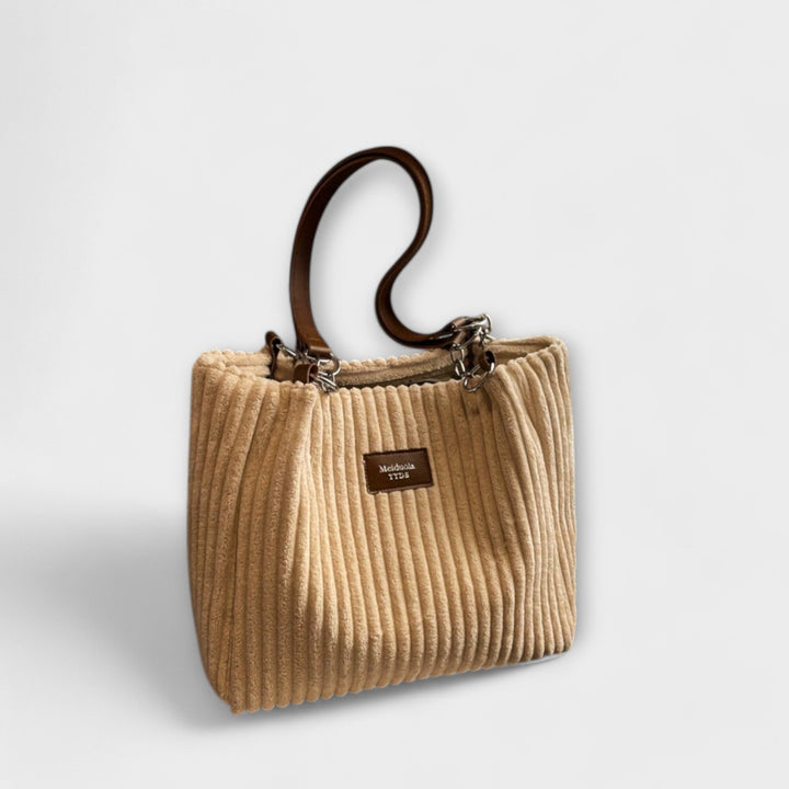 Black corduroy shoulder bag, a versatile women's everyday bag that can be worn crossbody for ultimate comfort.