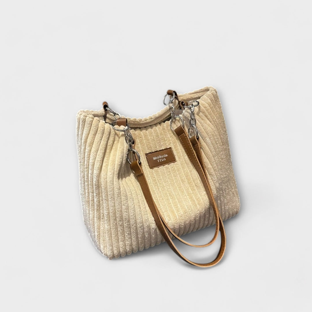 Textured beige corduroy women's shoulder bag, an everyday casual bag offering soft comfort and practical style.