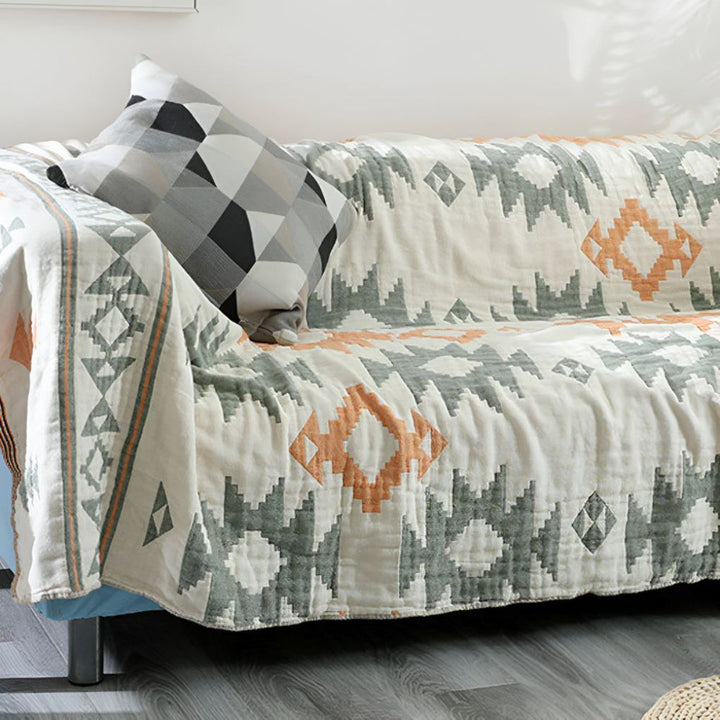 Lightweight reversible cotton muslin throw, perfect as a cozy sofa blanket or travel companion for spring & autumn.