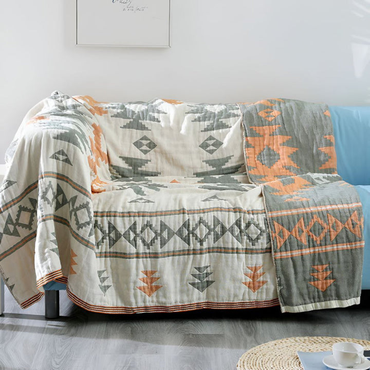 Unisex soft muslin gauze blanket, reversible with geometric design, a comfy, machine washable cotton throw for home.