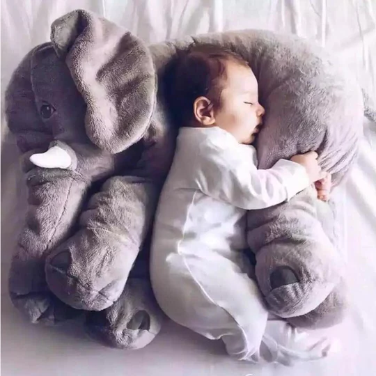 Soft gray baby elephant plush pillow for snuggles, playtime, and gentle tummy time support. A cute newborn gift.
