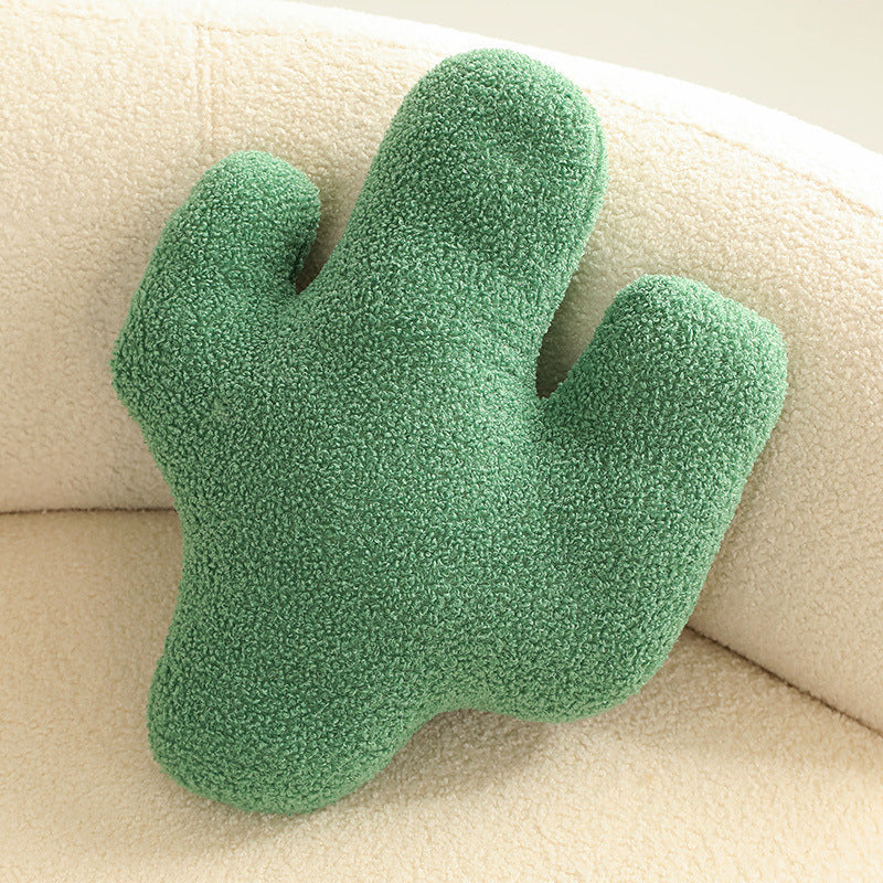 Cute green cactus cushion, enhancing modern home decor.