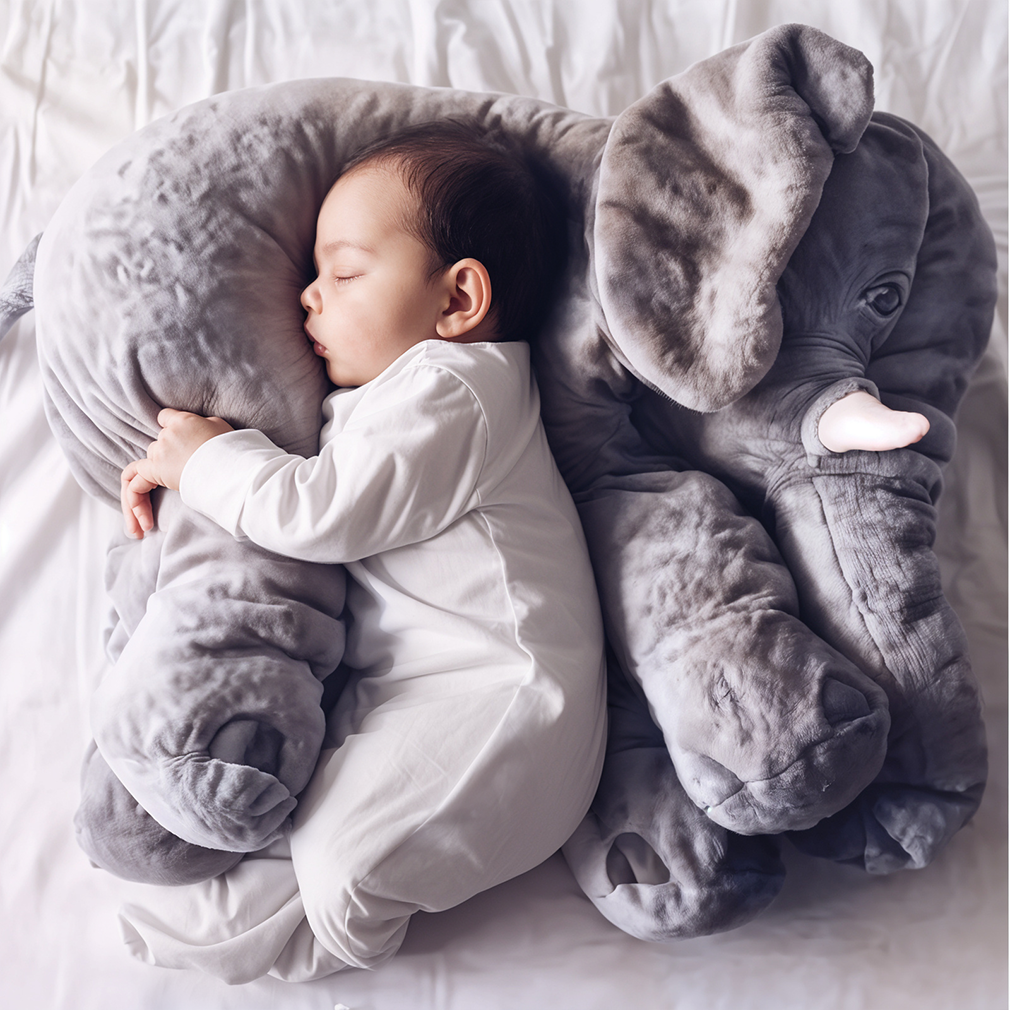 Soft plush elephant pillow for kids. Cuddly nursery decor & comfort animal, perfect for baby's room.