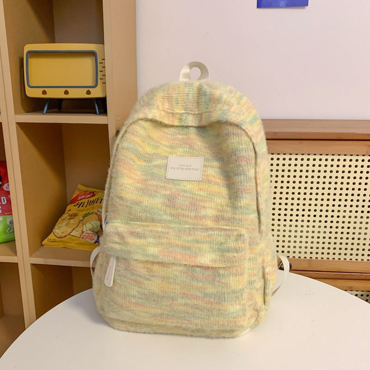 Unisex mini plush fabric backpack, compact and soft, ideal for casual daily use or stylish travel adventures.