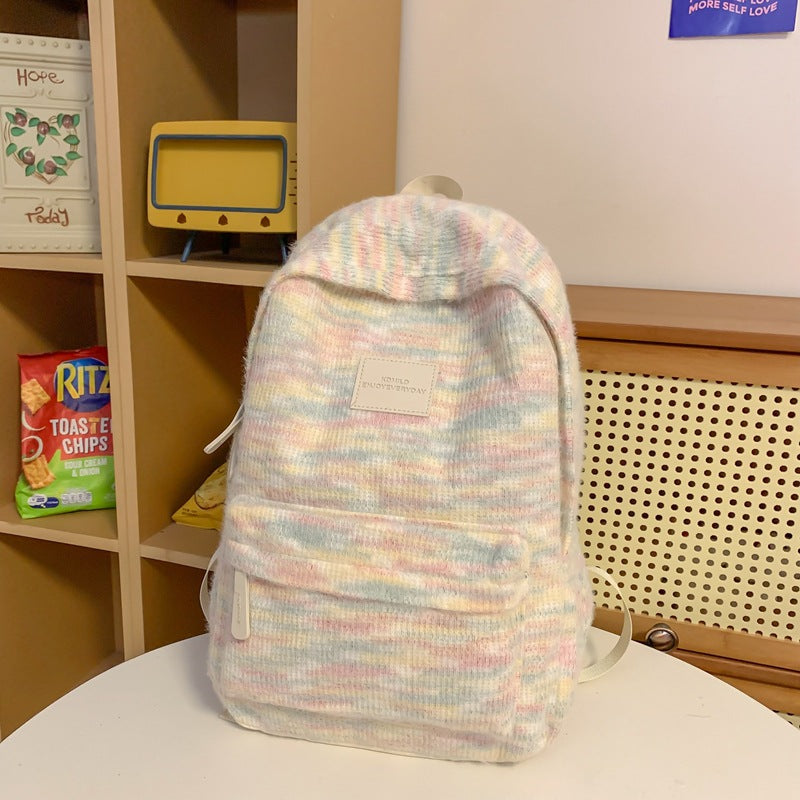 Stylish unisex plush mini backpack, compact design, soft fabric, perfect for casual outings & light travel.