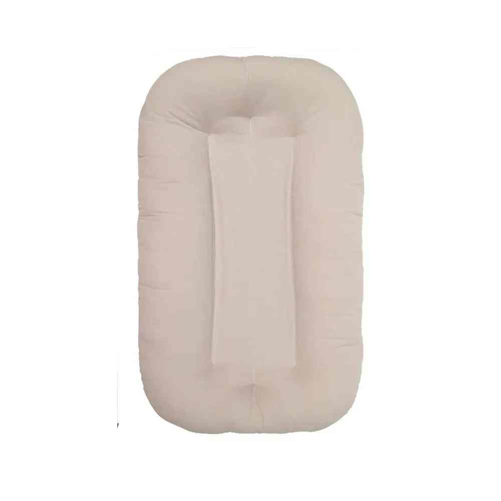 Plush Baby Comfort Sleeping Nest & Lounger, a soft infant bed providing a safe space for newborns in any nursery.