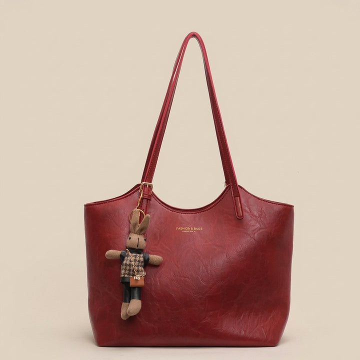 Versatile women's vegan leather handbag, a chic fashion tote with a distinctive charm for any outfit.
