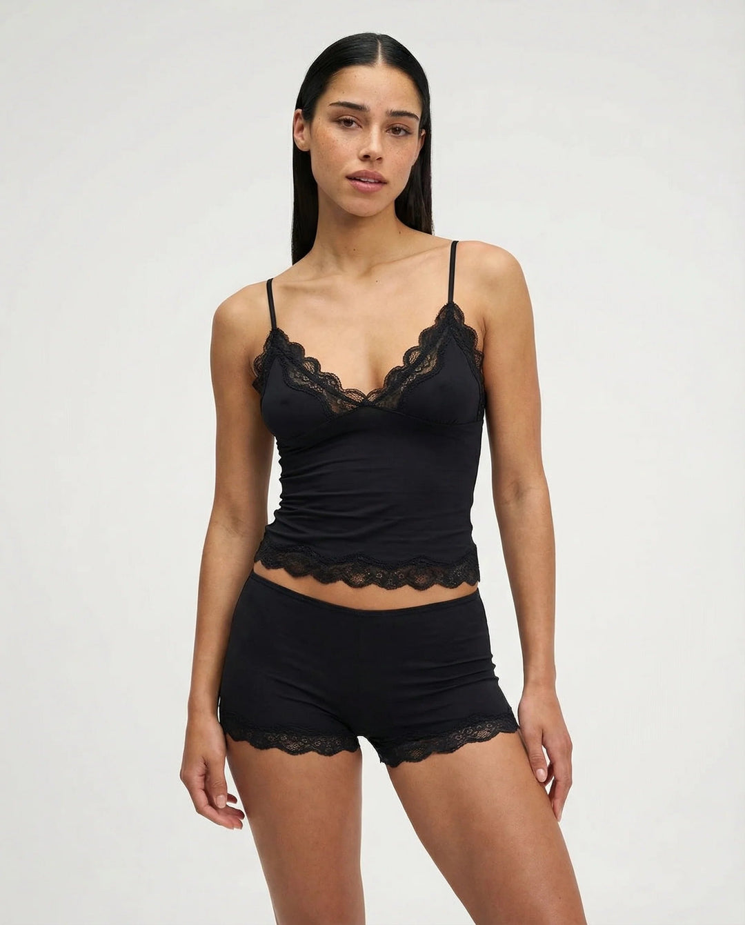 Soft women's camisole and shorts nightwear set with delicate lace trim for comfortable sleep and loungewear.
