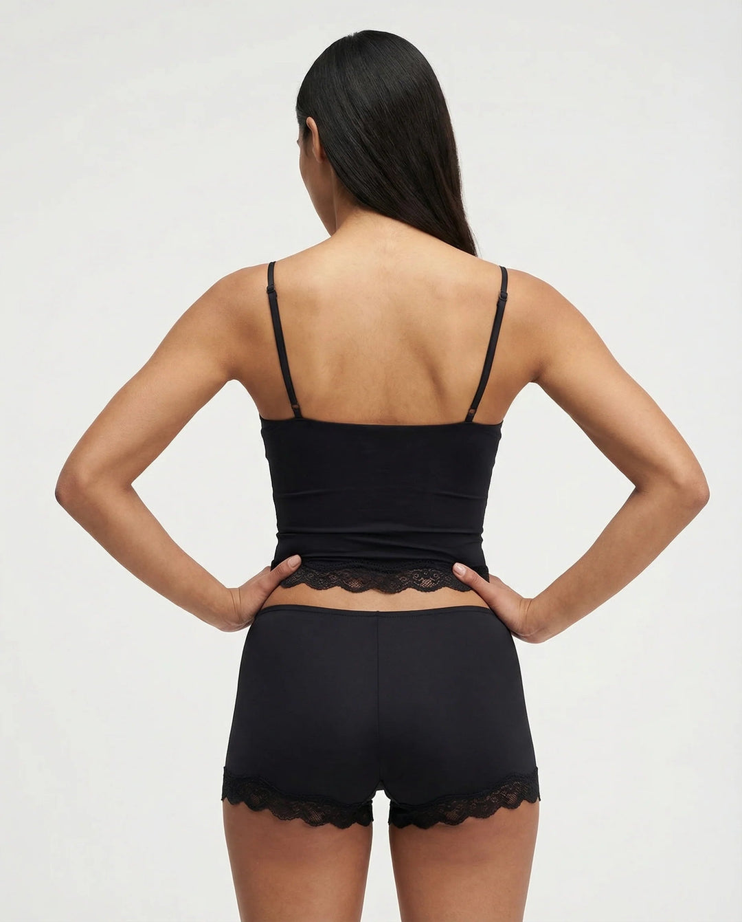 Ladies' intimate apparel: silky cami top and matching shorts featuring elegant lace details for ultimate comfort.