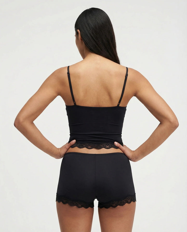 Ladies' intimate apparel: silky cami top and matching shorts featuring elegant lace details for ultimate comfort.