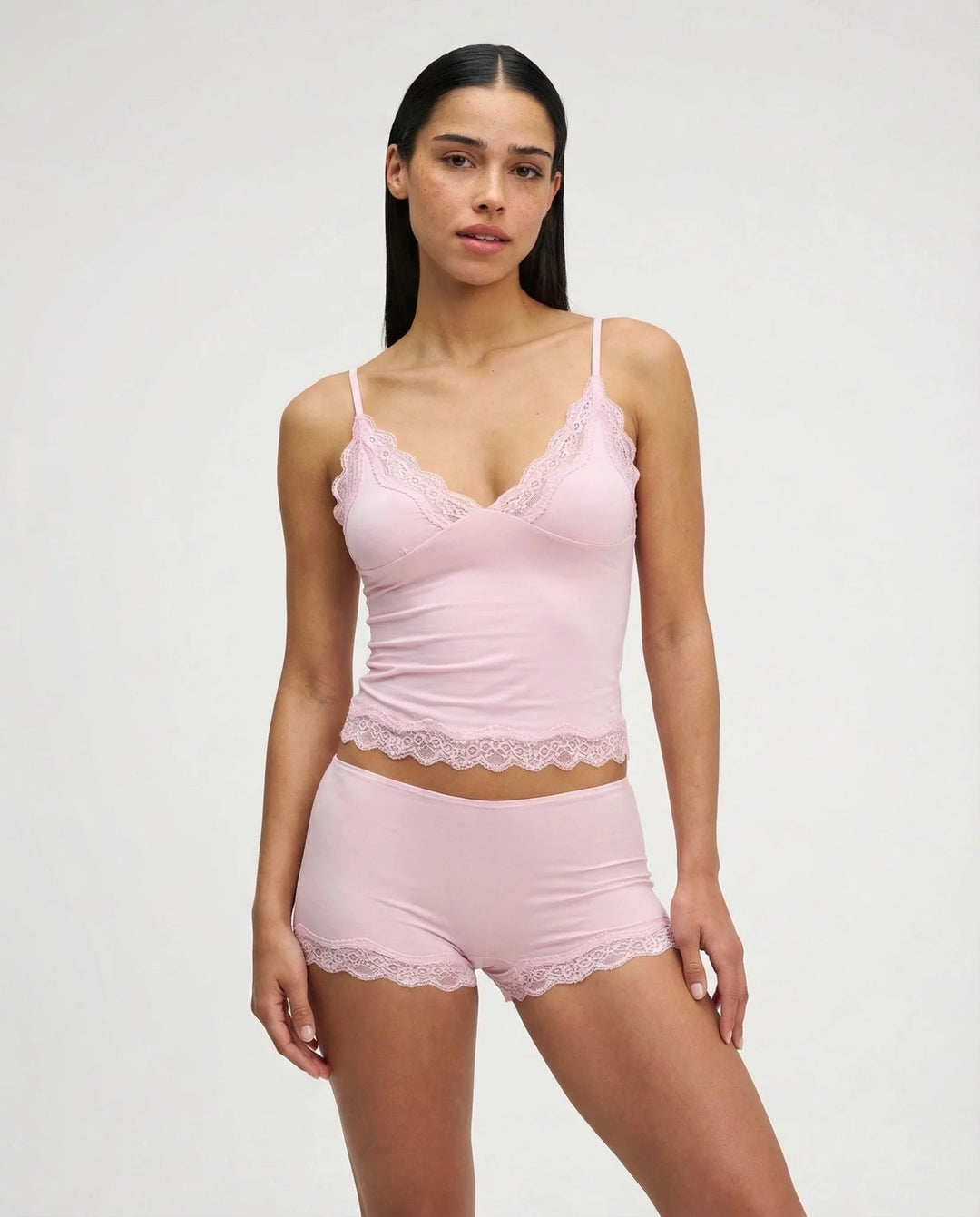 Relax in style with this two-piece women's soft sleepwear set, a camisole and shorts with pretty lace accents.