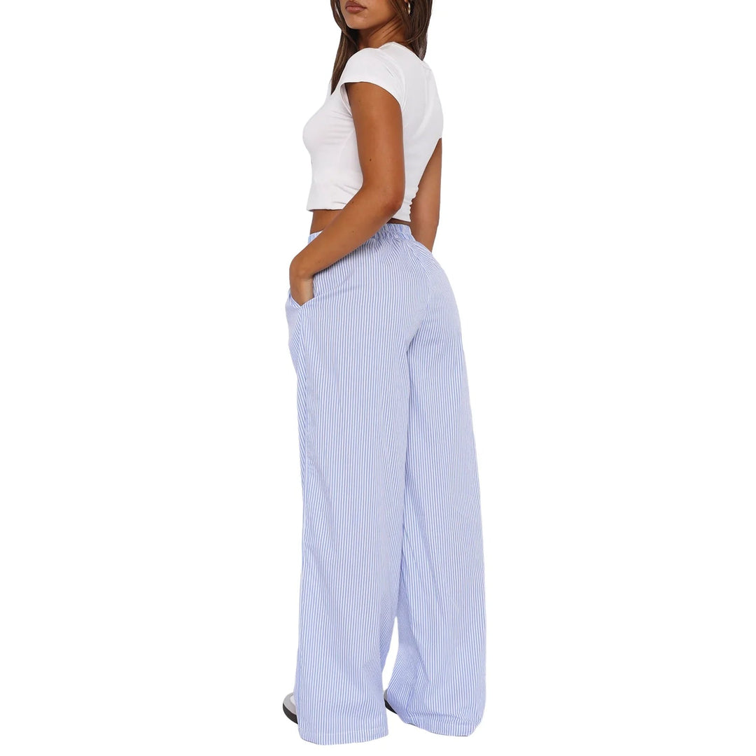 Pink relaxed fit women's lounge pants. Ultra-soft fabric, elastic waist, & pockets for maximum comfort & style.