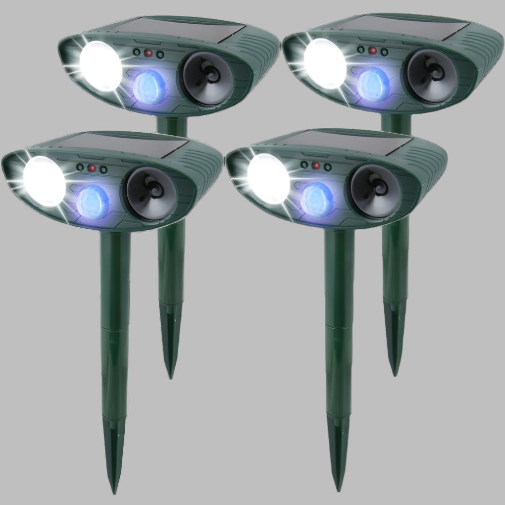 Multiple solar ultrasonic rabbit repellers spaced in a large yard. Comprehensive animal deterrent & pest control.