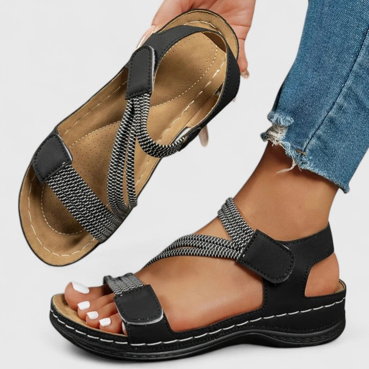 Women's health sandals, promoting foot comfort & posture correction with ergonomic arch support.