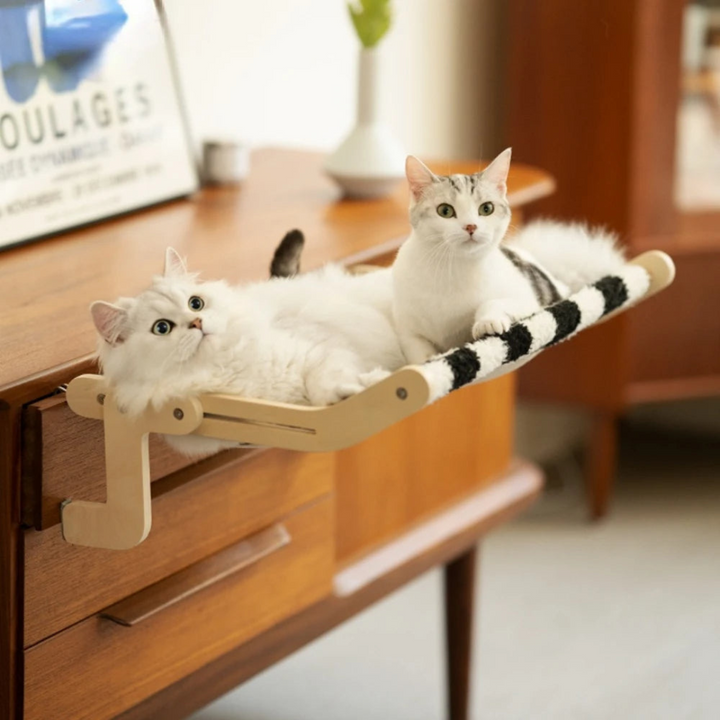 Space-saving cat hammock, a stylish & cozy under-furniture pet bed for feline comfort.