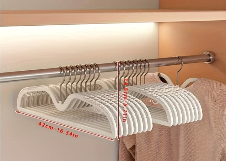 Compact space-saving hangers with rotating hooks, essential for neat and tidy wardrobe management.