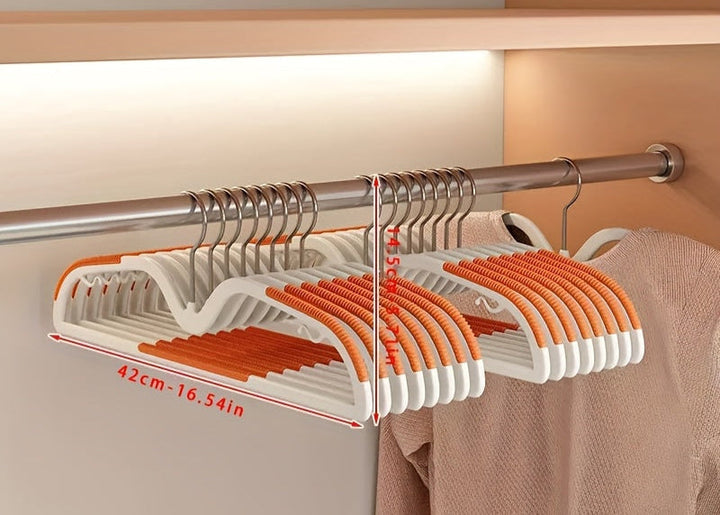 Premium non-slip plastic hangers for clothes, featuring a rotating hook for ultimate closet organization.