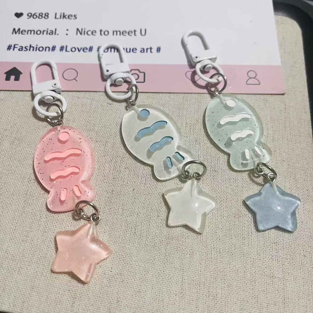 Sparkling acrylic fish & star charm keychain, a cute unisex bag accessory.