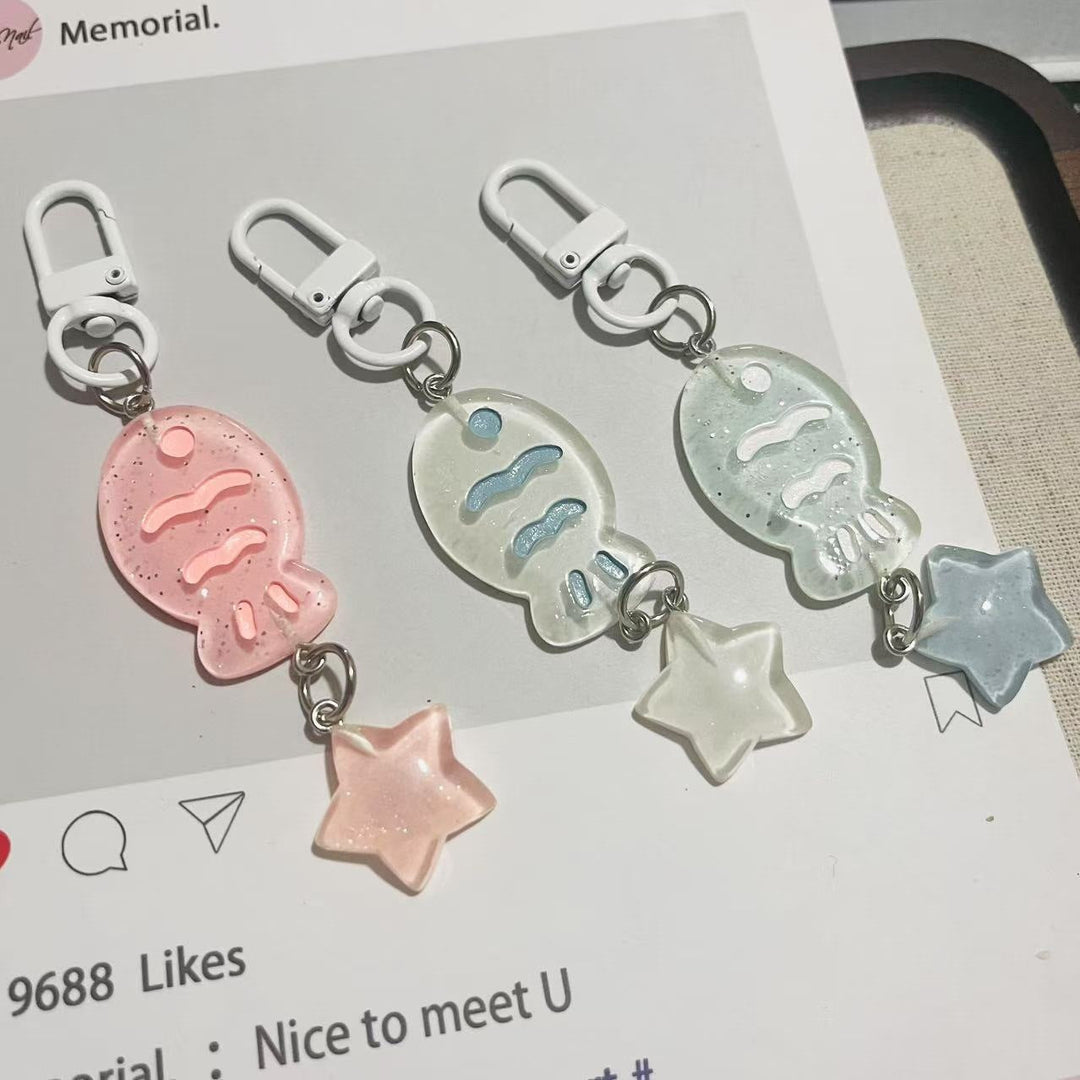 Cute fish & star charm keychain made from sparkling acrylic, great for bags or keys.