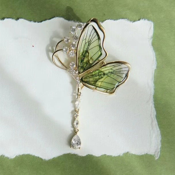 Elegant sparkling butterfly brooch with glitter stones, a stunning women's accessory, ideal gift for her dress or jacket.