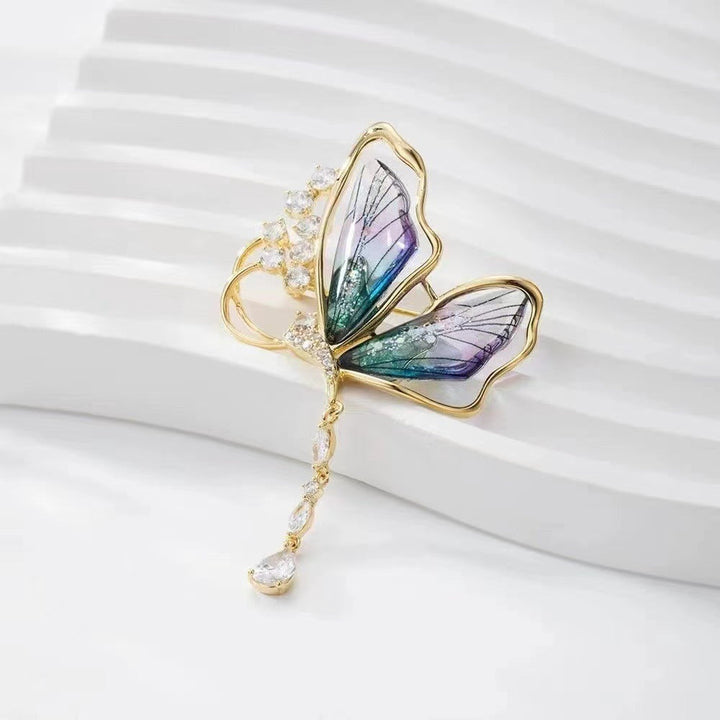 Glamorous sparkling butterfly brooch with glitter stones, an elegant women's jewelry pin to elevate any outfit.