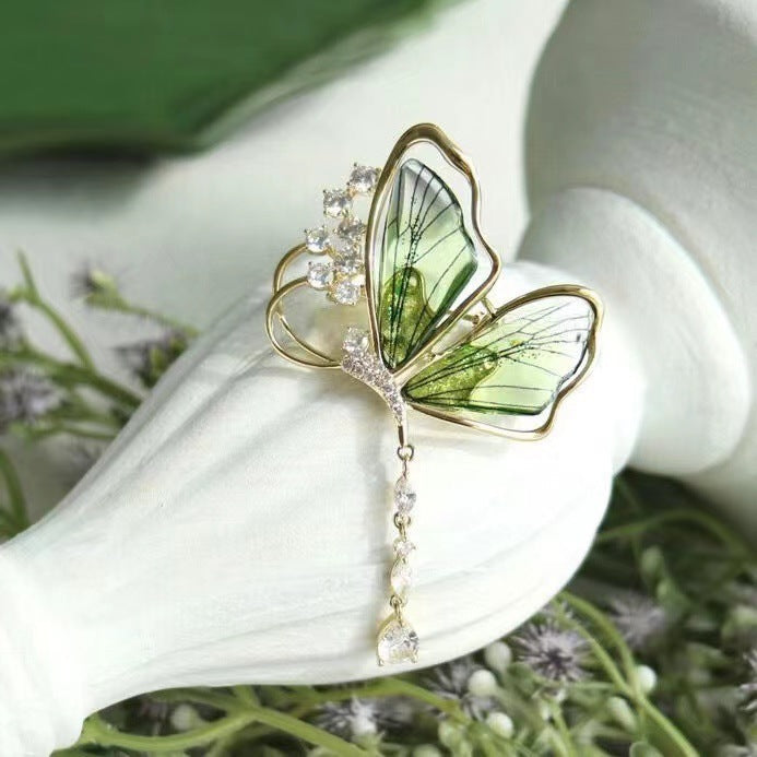 Unique sparkling butterfly brooch with detailed glitter stones, a beautiful women's elegant accessory for jackets & dresses.