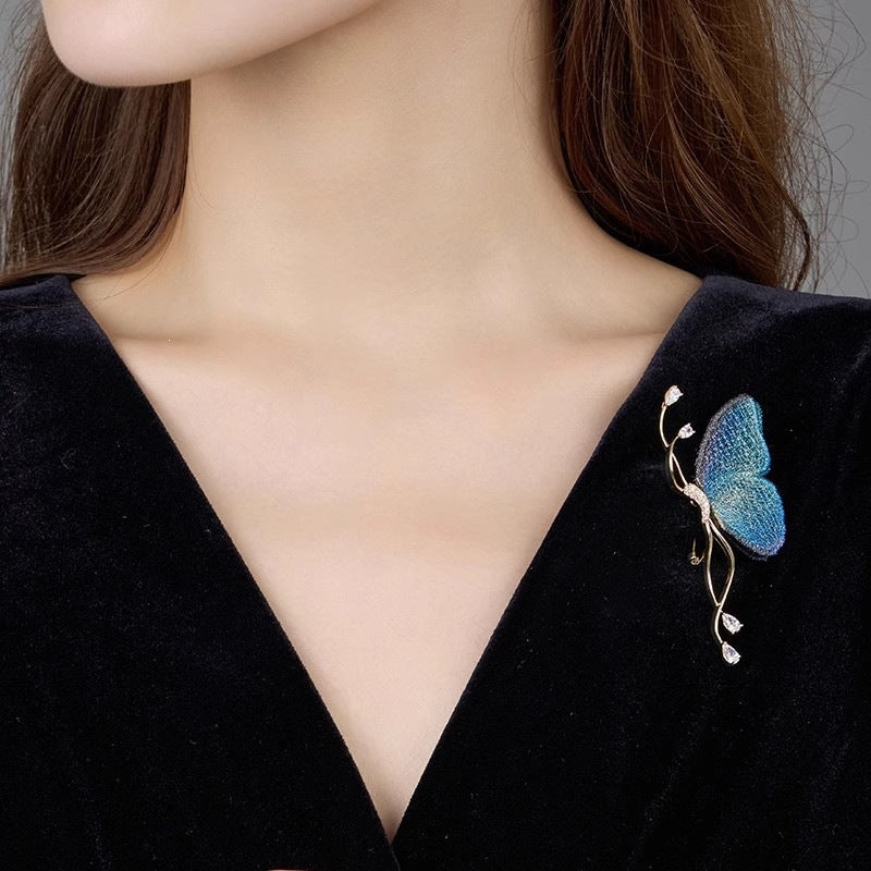 Delicate silver-tone butterfly pin with sparkling crystals, a beautiful fashion jewelry piece for her.
