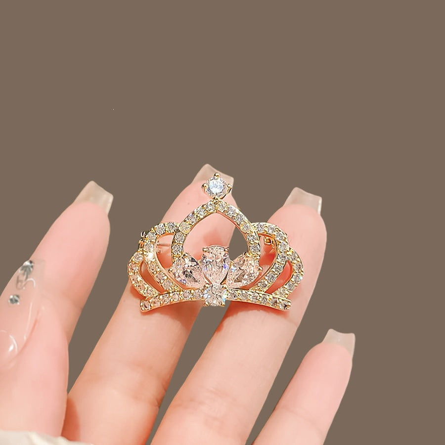 Shimmering crystal crown brooch pin, a beautiful women's accessory and elegant gift idea for her.