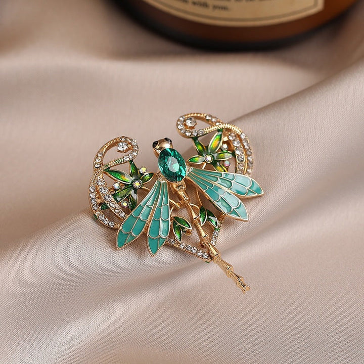 Versatile sparkling crystal dragonfly accessory for women, an elegant brooch to enhance any dress or scarf.