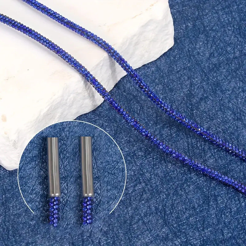 Close-up of a sparkling crystal-studded lanyard, highlighting the intricate design & shimmering stones.