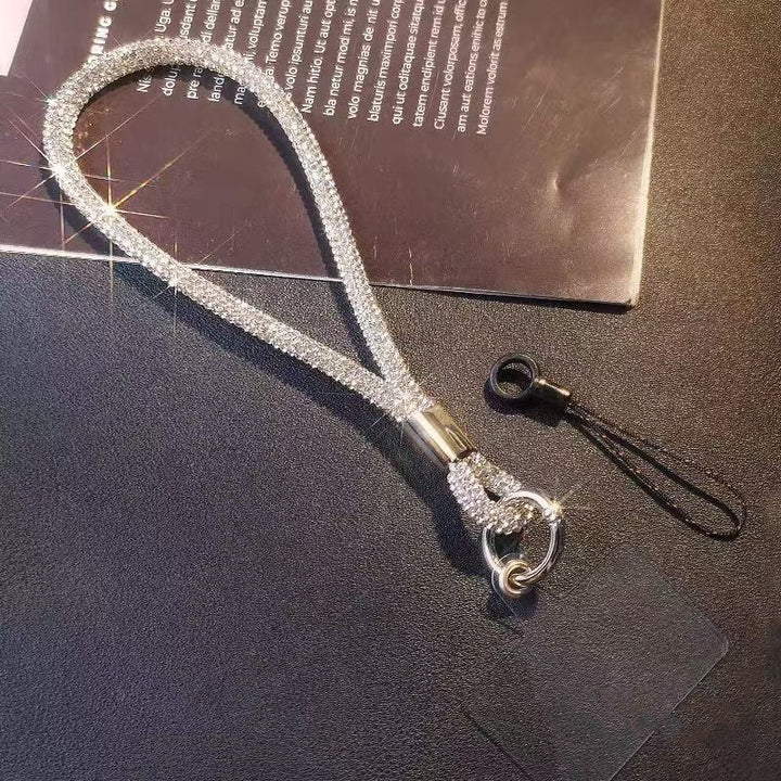 Secure and stylish sparkling crystal wrist strap. Unisex lanyard for phones, keys, and ID badges. Fashion accessory.