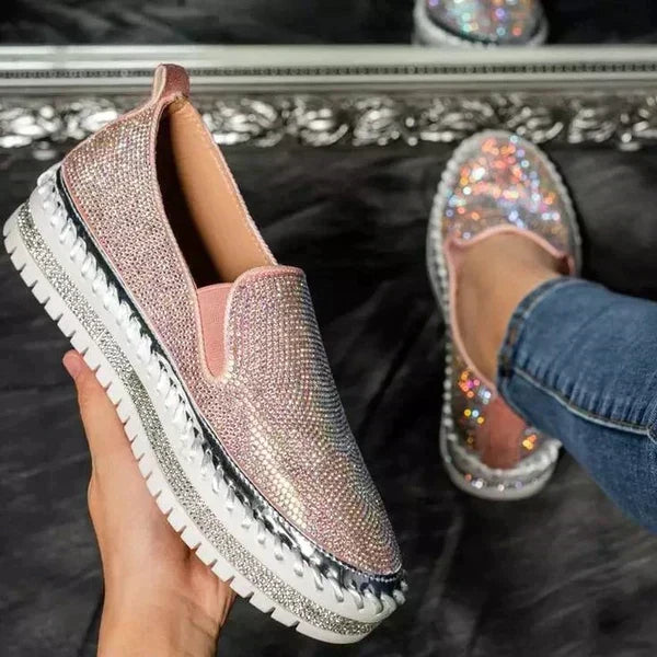 Comfortable pink sparkling slip-on shoes for women. Glamorous & versatile for parties, summer, or elegant casual wear.