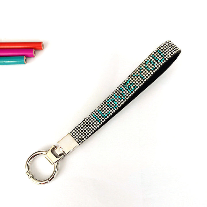 Chic 'I Love You' rhinestone bag charm. Sparkling, durable keychain accessory for keys and handbags.