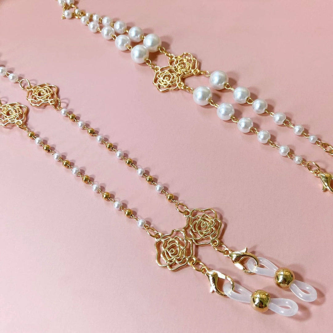 Close-up of sparkling pearl & floral glasses chain, a stylish beaded eyeglass holder for fashion eyewear.