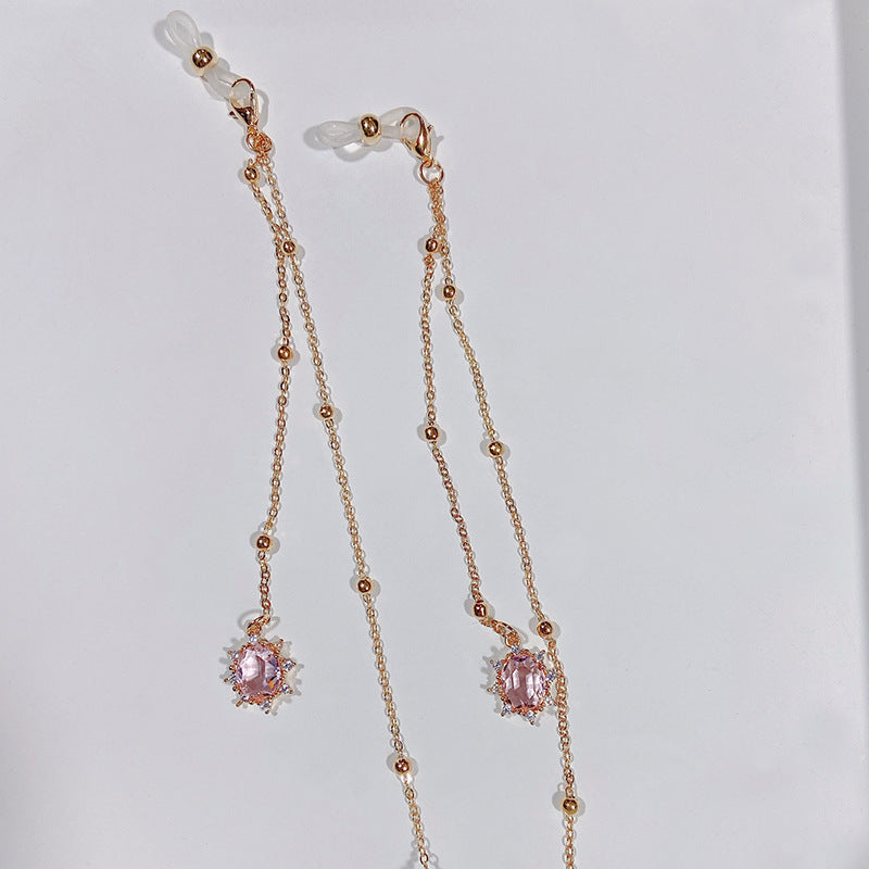 Beautiful women's crystal necklace featuring a vibrant pink sparkling pendant, fashion accessory.