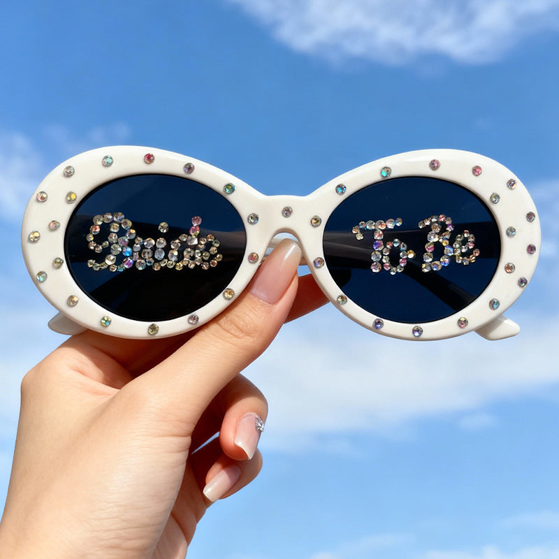 Sparkling rhinestone cat-eye bridal sunglasses for women, perfect wedding accessory.