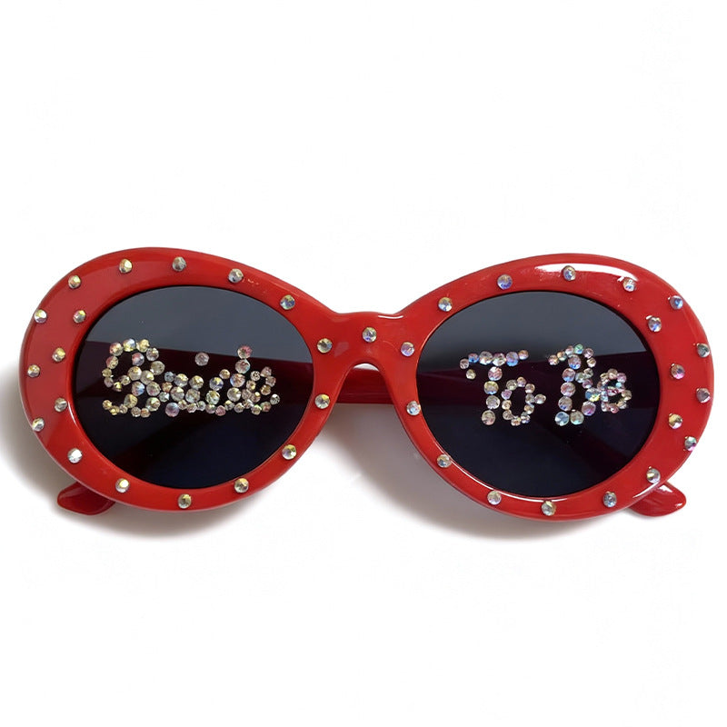 Elegant women's cat-eye bridal sunglasses with rhinestones, ideal wedding accessory.