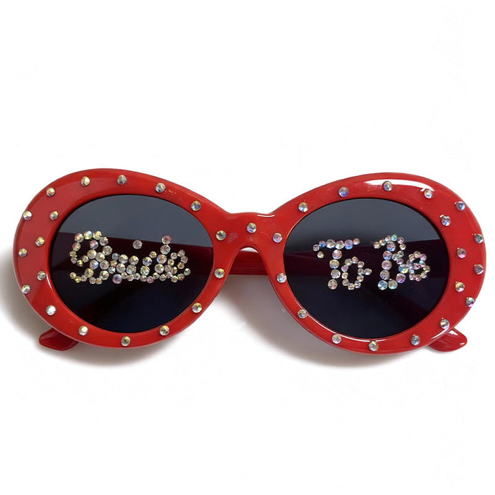 Elegant women's cat-eye bridal sunglasses with rhinestones, ideal wedding accessory.