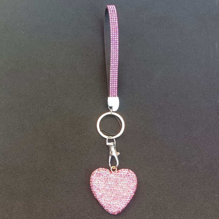 Glittering heart rhinestone keychain for women. Versatile accessory for bags, keys, & purses. Ideal elegant gift.