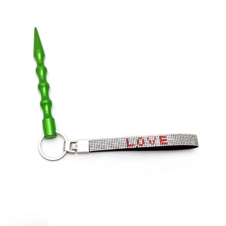 Gold-tone love heart rhinestone key ring, a luxurious bag accessory.